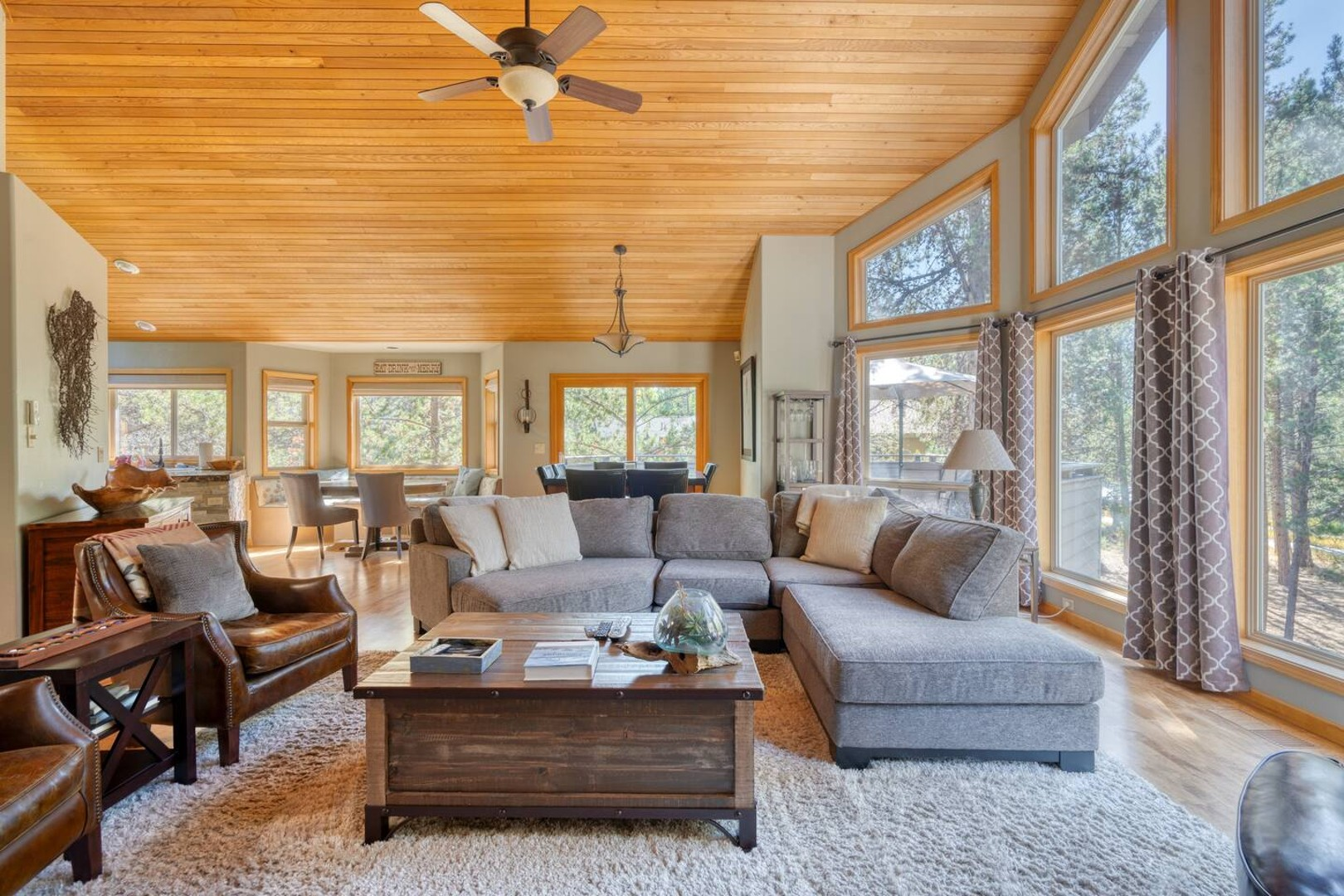 Sunriver spa home living room with vaulted wood ceiling